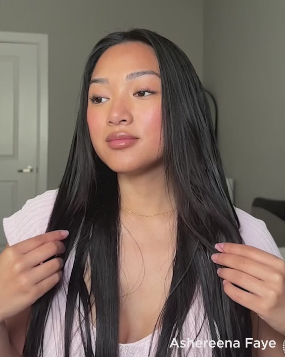 Video demonstration of content creator using mousse to add volume to flat hair.