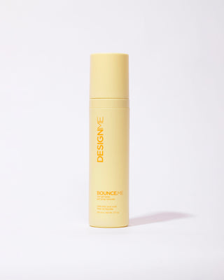 DESIGNME BOUNCE.ME Curl Spray Gel bottle shown from the front.