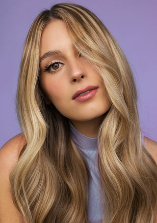 Model with smooth, shiny, healthy-looking hair after using FAB.ME Leave-In Treatment.