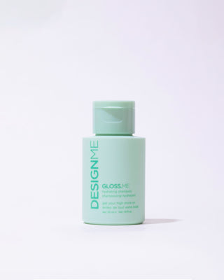 Front view of travel-size GLOSS.ME Hydrating Shampoo bottle, compact and sleek.
