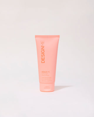 Front view of travel-size HOLD.ME Styling Cream bottle, compact and sleek design.