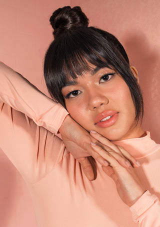 Model uses DESIGNME HOLD.ME Three-Way Hairspray for sleek style and strong, flexible hold.