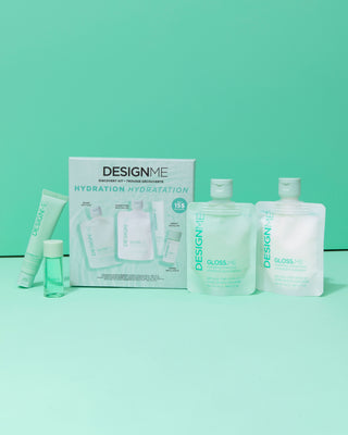 DESIGNME Hydration Discovery Kit on green background, featuring GLOSS.ME shampoo, conditioner, mask, and hair oil.