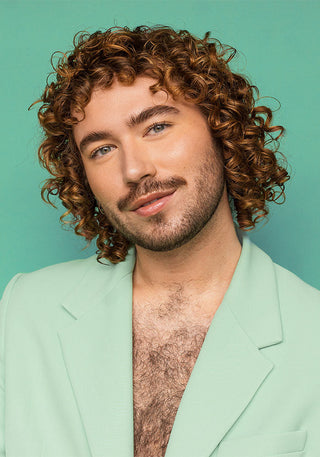 Male model with defined, shiny 3A curls, showing smooth, hydrated hair after using the Shine & Strength Bundle.